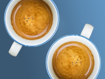 Cups of coffee on blue background